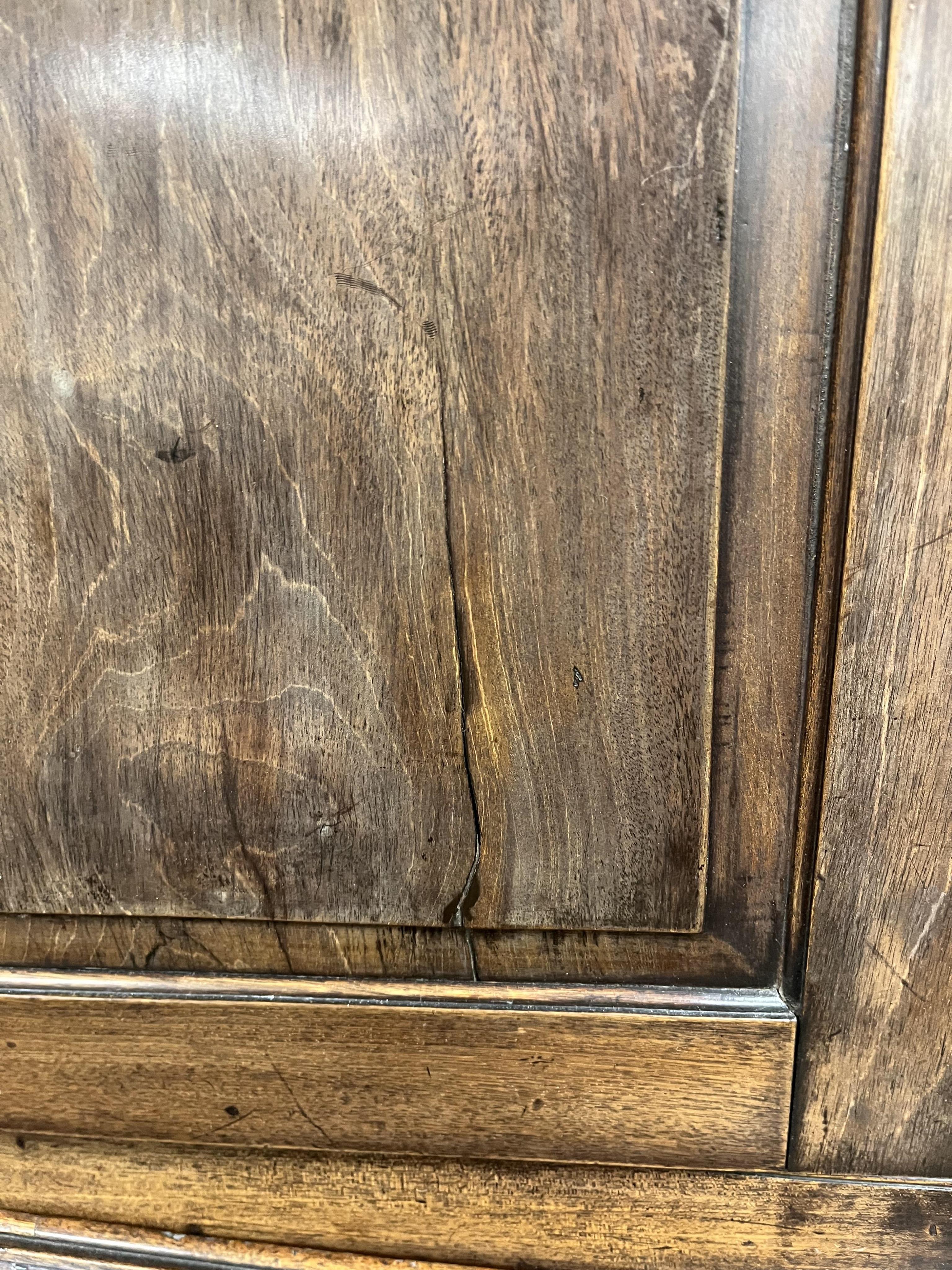 A small George III mahogany bureau cabinet with broken arch pediment, width 95cm, depth 62cm, height 198cm